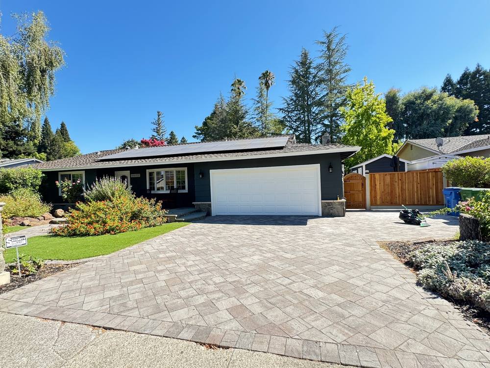 Ranch home fully repainted in charcoal with white trim