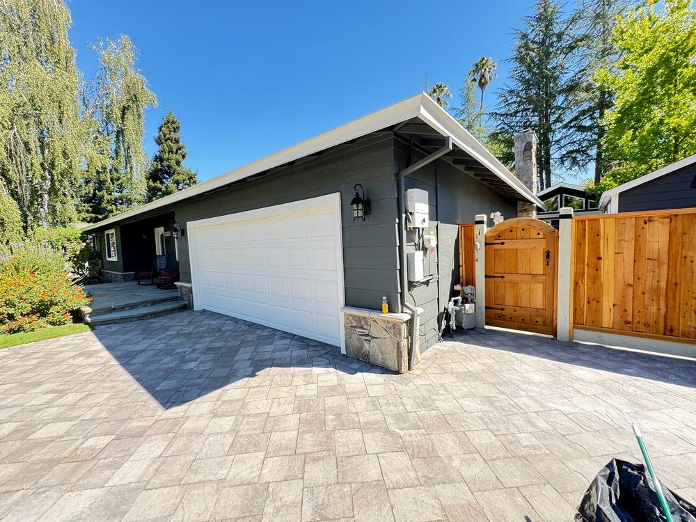 Repainted garage and fence detail with stone accents